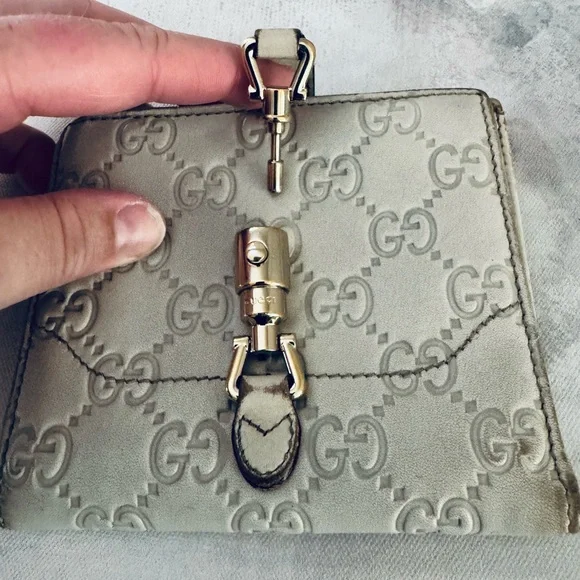 Gucci Guccissima Ivory Leather GG Logo BiFold Wallet, Gold Piston Closure